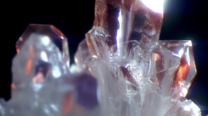 Aufkleber - Bright, graceful crystals come to life in animation, their surfaces gently shimmering in shades of blue and golden orange. Moving light reflections accentuate their beauty against a dark background