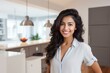 © nsit0108 - Portrait of a beautiful young indian woman smiling in her modern kitchen