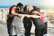 © peopleimages.com - Fitness team, friends and huddle outdoor for synergy, support and training motivation at promenade. Sports group, circle and people together for health goals, wellness and target achievement at sea
