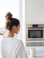 Poster - Modern AI-Enhanced Cooking Young Indian Woman in Minimalist Smart Kitchen with Voice-Controlled Tech and Sustainable Metallic Accents - Future Home Efficiency