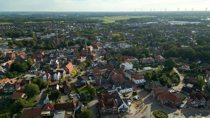 Wall Mural - An aerial panorama view around the old city Friesoythe in north Germany on a sunny morning in summer.