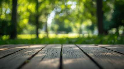 Wall Mural - A blurred view of a wooden deck in a lush, green park setting.