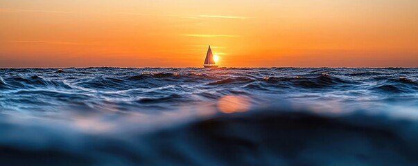 Wall Mural - sunset over ocean waves nature idea. a serene sunset view over the ocean with a silhouette of a sail