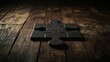 © huhu - Dark wooden surface with two connected black puzzle pieces.