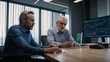 © Josif Rei - Financial Analysts Reviewing Market Data in Modern Office