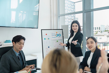 Wall Mural - diverse business team presenting financial data in a modern office, showcasing collaboration and str