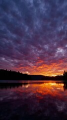 Poster - Watch the sky transform into a canvas of vibrant colors during a stunning sunset over a peaceful lake. Let this visual masterpiece inspire and soothe your soul.