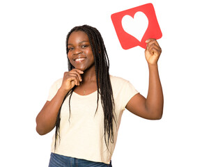 Wall Mural - Young African girl holding romantic heart paper shape over transparent isolated background doing ok sign with fingers, excellent symbol. PNG transparent.