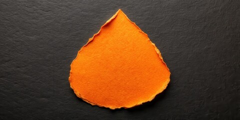 Poster - Torn Orange Paper Drop Shape on Dark Background