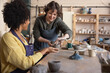 © ReeldealHD images - Friendly Artist teaching a Pottery class