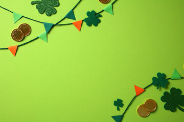 Wall Mural - Festive St. Patrick's Day background with green shamrocks, gold coins, and colorful bunting on a vibrant green surface.