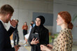 © .shock - A business team engages in a lively discussion during a coffee break, exchanging challenges and sharing moments of laughter, fostering a positive and collaborative work environment