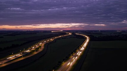 Aufkleber - City road illuminated by traffic lights during twilight with a scenic landscape