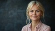 © BlackBird Studio - Smiling Middle-Aged Woman with Blond Hair in Professional Portrait