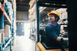 © Davor - Warehouse worker operating forklift in storage facility