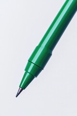 Wall Mural - Close-up view of a green pen on a white background, ideal for use in designs related to writing, creativity, or technology