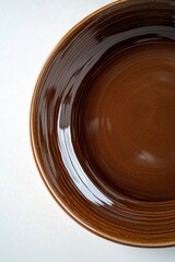 Wall Mural - A detailed view of a brown plate on a table, ideal for food or product photography