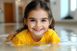 © Jutharat - Adorable Girl in Yellow Shirt Playing in Water Realistic Photo