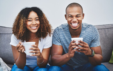 Poster - Happy, portrait and couple with coffee on sofa for talking, conversation and bonding together on weekend. Love, relationship and man and woman with drink, warm beverage and tea to relax in home