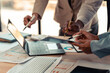 © MrAshi - Businessman's hands and documents for a meeting budget planning and network strategy, business people, financial and technology documents at the table for creative research analysis