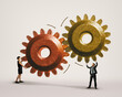 © svetazi - The man and woman are connecting large gears as a metaphor for interaction and teamwork. Art collage.