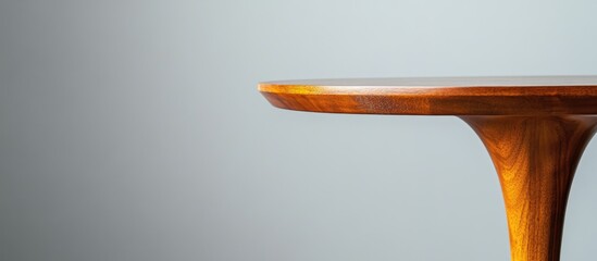 Wall Mural - close-up of wooden table edge against gray background with copy space
