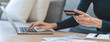 © KMPZZZ - Internet banking, Online shopping at home, asian young woman hand in typing on keyboard, holding credit card, using laptop computer, spending money with purchase on store at home. Shopaholic ecommerce
