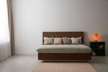 Wall Mural - Cozy bedroom interior with mocha mousse shade. Trendy color of 2025 year