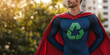 © Ірина Пальцева - A man dressed as a superhero with a recycling emblem on his chest stands confidently outdoors, representing sustainability, eco-consciousness, and advocacy.