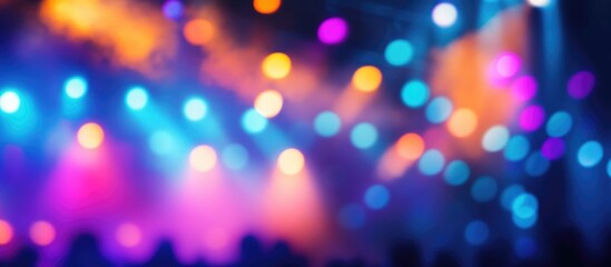 abstract blurred background of colorful stage lights in concert with vibrant bokeh effects and textu