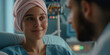 © Mariana Mejia - Hopeful patient wearing pink headscarf smiles at doctor in hospital room