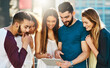 © Donson2000/peopleimages.com - City, smile or friends on tablet for reading gossip, online update or news to relax in urban street. Happy, outdoor or people on touchscreen for travel planning, social media post or blog together