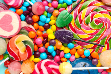 Wall Mural - Sweet lollipops and candies as background, closeup