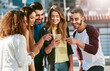 © Donson2000/peopleimages.com - City, laughing or friends with phone for funny joke, online meme or news to relax in urban town. Happy, outdoor or people on mobile app for travel planning, social media humor or comedy blog together