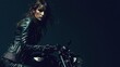 © aleks - Confident woman in leather jacket poses on motorcycle in a dramatic, low-light setting
