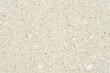 © TuruMuru - Light beige brown particleboard background with a grainy texture