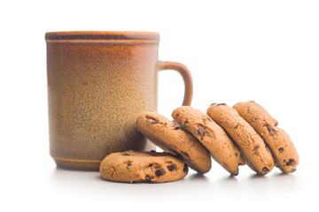 Wall Mural - Chocolate chip cookies and mug  isolated on white background.