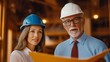 © art_bee8 - Construction professionals discussing blueprints on a building site with safety gear