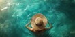 © Fox - A figure swims in turquoise waters, wearing a stylish straw hat that symbolizes vacation vibes, capturing the essence of relaxation and joy during a delightful summer beach outing