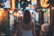 © blvdone - Woman walking street at night