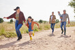 © peopleimages.com - Family, generations and mother with girl, farm and walking for countryside, holiday and happy together. Woman, grandparents and child or daughter for vacation, bonding and love in rural environment