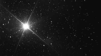 Wall Mural - Bright star shining in the dark sky with lens flare effect