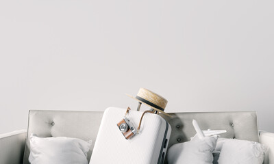 Fototapete - Luggage with camera and straw hat on sofa at home. Travel ready concept. 3d rendering