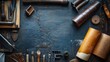 © Prapanista - top view collection set A top view of various leather crafting tools beautifully arranged on a rustic workbench.