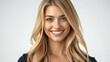 © Michael - A woman with long blonde hair smiles at the camera in front of a white background