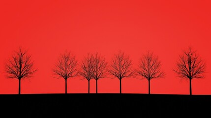 Poster - Silhouetted Trees Against Red Sky at Dusk