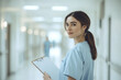 © Viktoriia - Portrait of a nurse in light blue scrubs: healthcare professional in a hospital setting