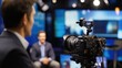 © phy - TV interview setting featuring a prominent figure answering questions from a news anchor in a professional studio