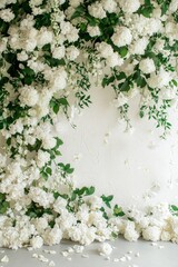 Wall Mural - Elegant white floral backdrop with cascading greenery for events and celebrations