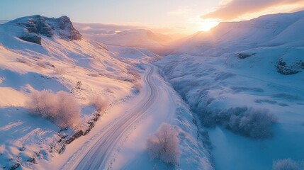 Wall Mural - Winter Sunrise Over Snow Covered Mountain Road